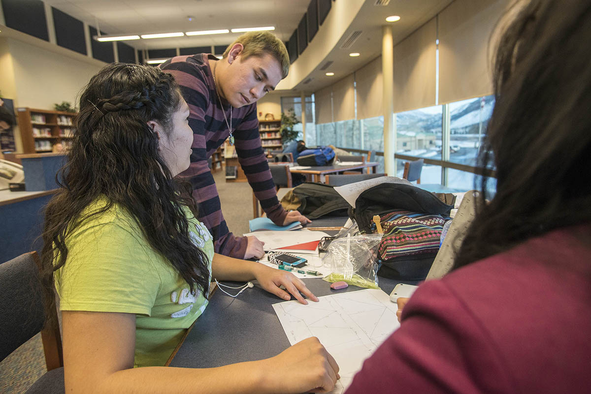 Photo of tutor with Upward Bound students