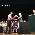 Photo of student receiving scholarship award