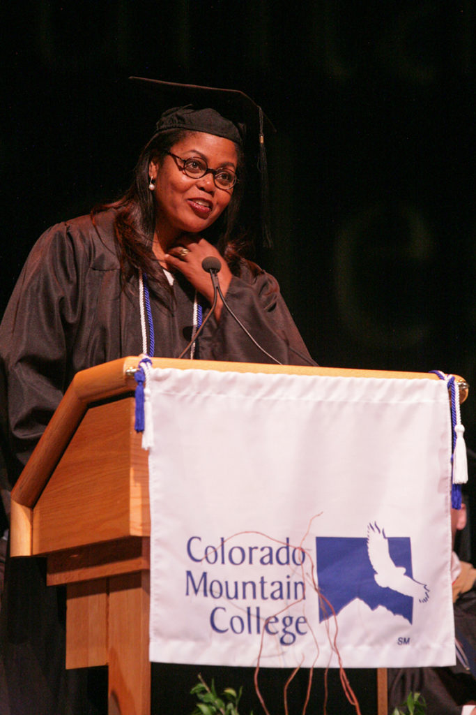 Photo of Carol Lewis-Zilli, three-time U.S. Olympian, speaking at CMC Edwards commencement on May 6