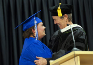 Photo of graduate Alta Bobian receiving congratulations from Heather Exby, Colorado Mountain College’s dean of the Roaring Fork campus