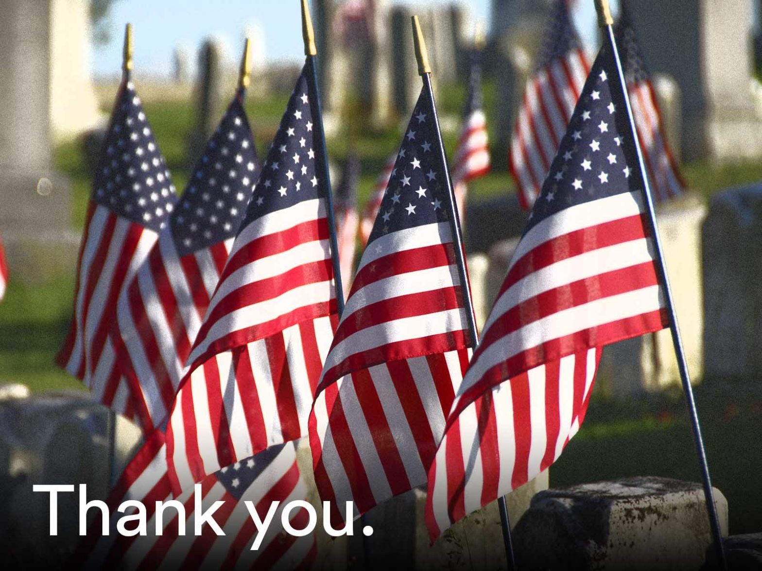 Photo of U.S. flags with the words Thank you on them, for Memorial Day