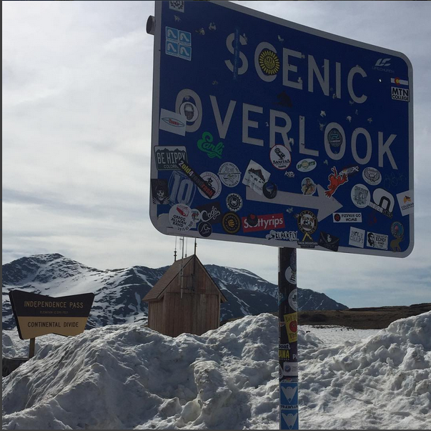 Photo of Scenic Overlook road sign plastered with stickers