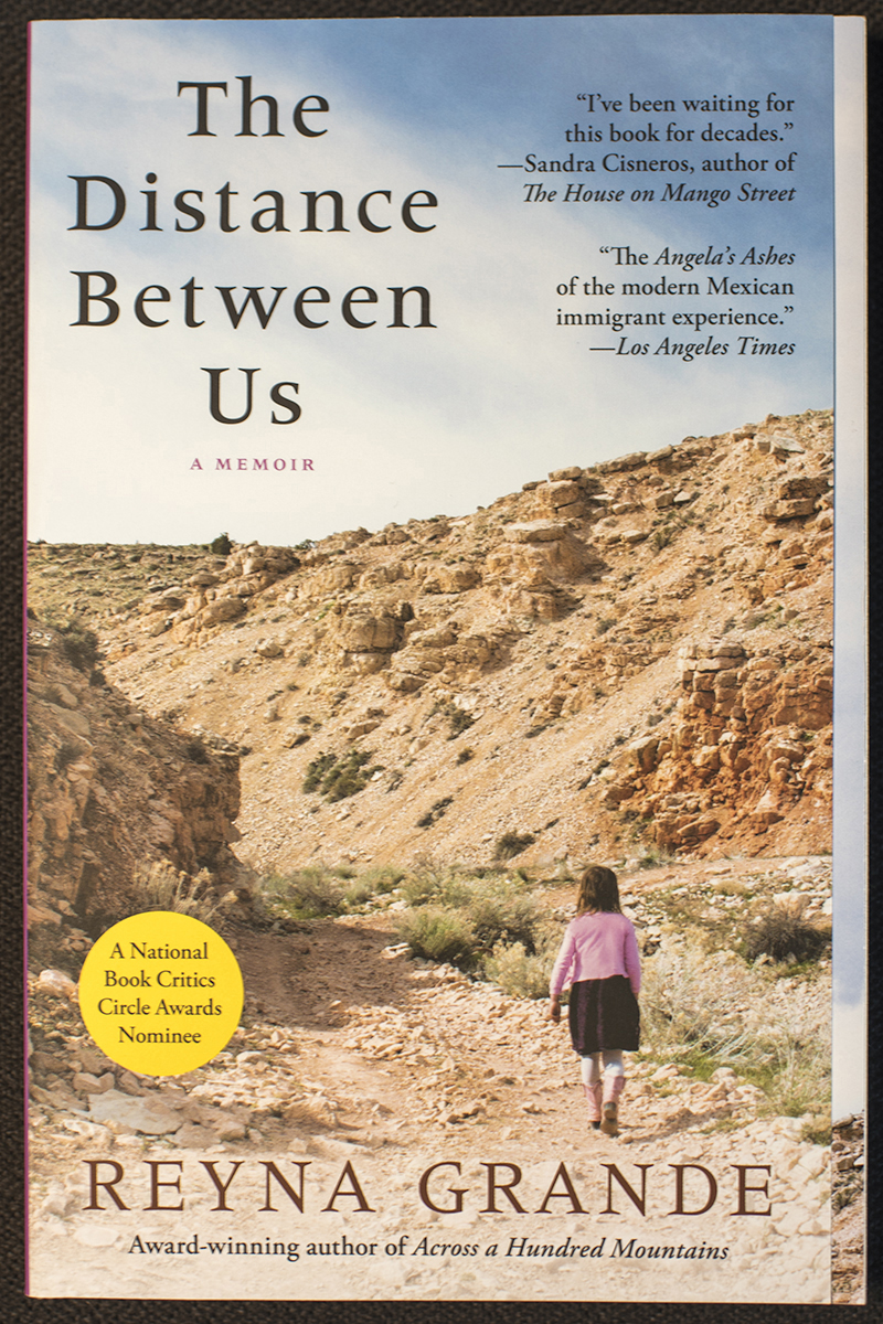 Photo of the book cover of the Common Reader, "The Distance Between Us."